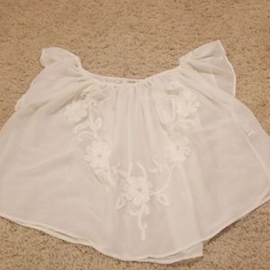 White sleeveless crop blouse